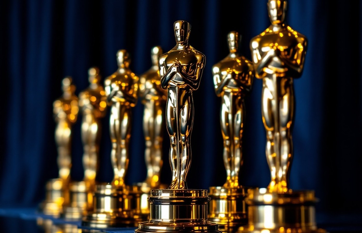 Golden statuettes against blue velvet